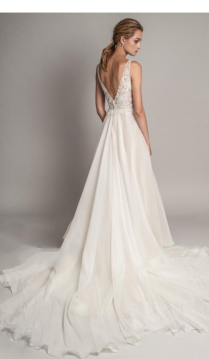 Flattering lace and chiffon wedding dress with V-neckline and