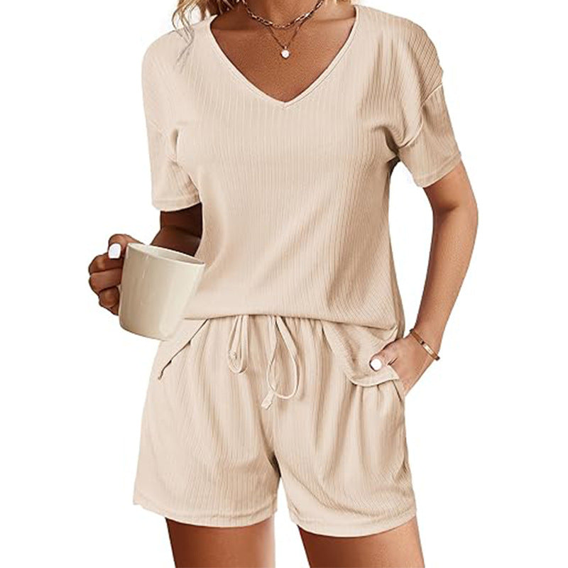 V-Neck short sleeve shirt and shorts set in beige, made from polyester fabric.