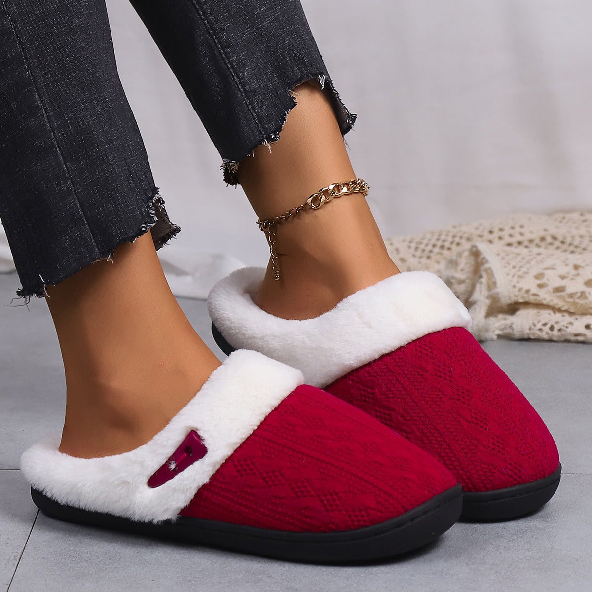 Women's warm non-slip red slippers with white lining and rubber sole.