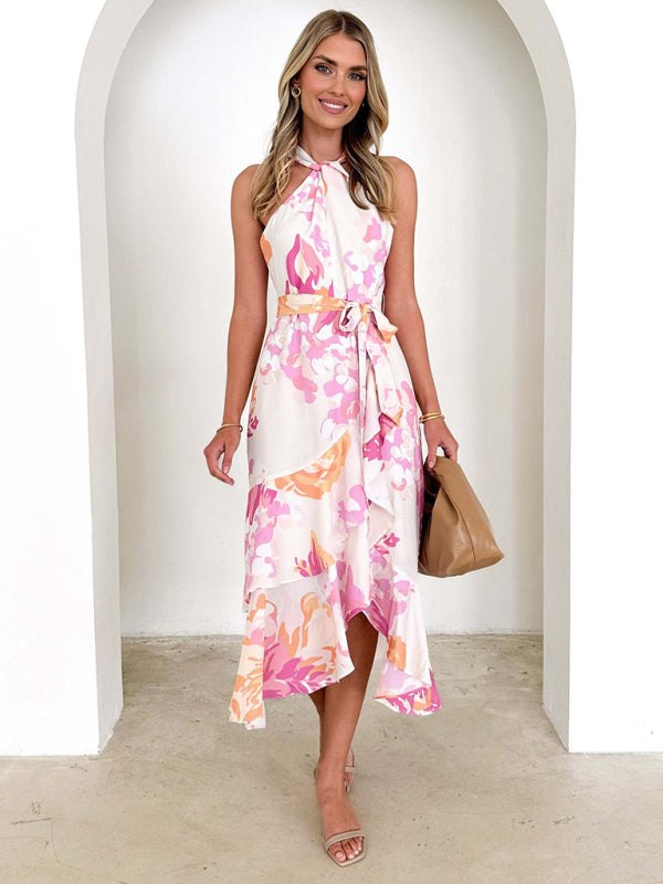 Sleeveless halter neck midi dress with pink and green floral pattern.