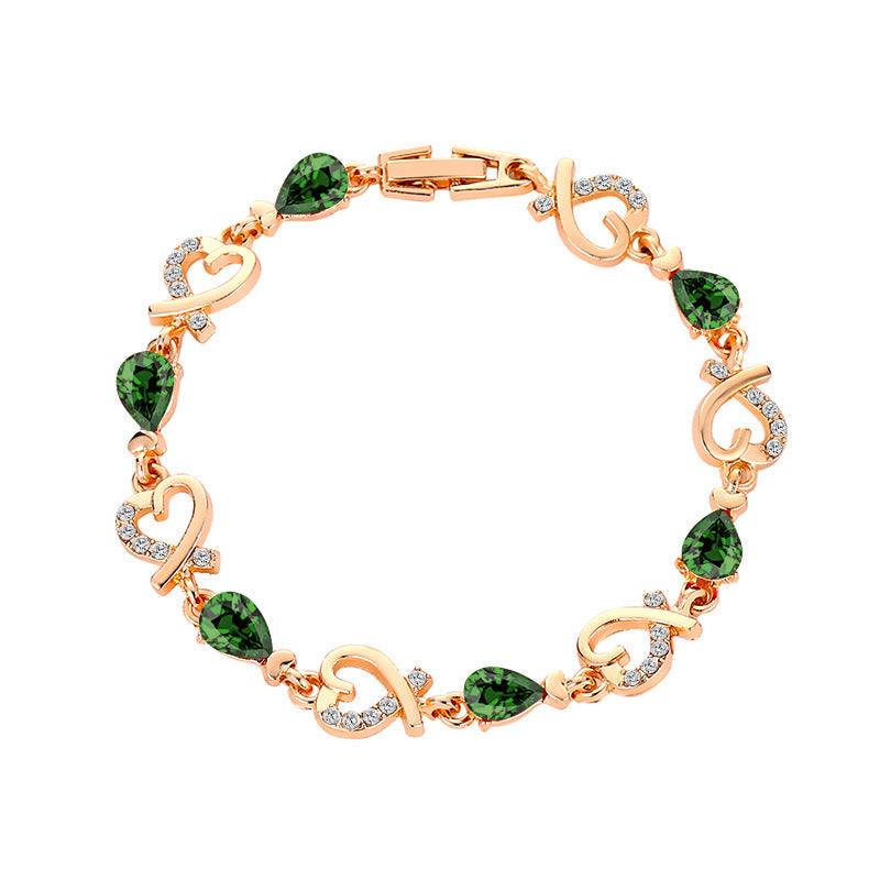 Heart-shaped rhinestone bracelet in copper with secure clasp.