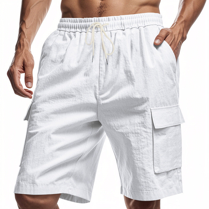 Men’s white linen shorts with elastic waist and pockets.