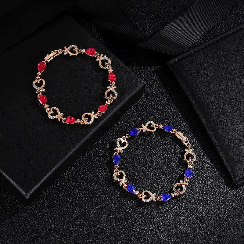 Heart-shaped bracelet with rhinestones in red and blue options