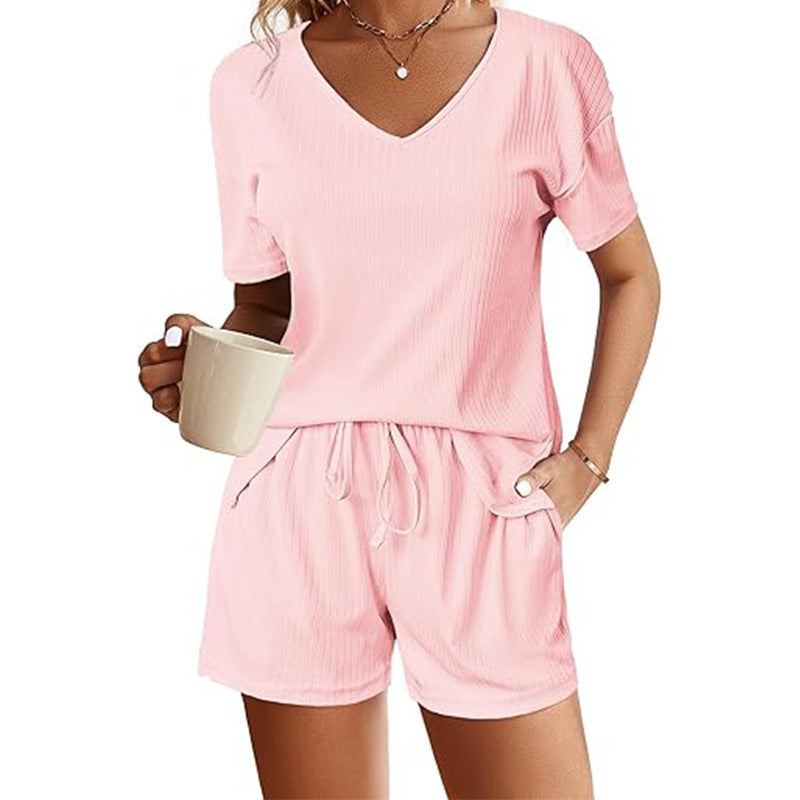 V-Neck short sleeve shirt with matching drawstring shorts set, in pink, featuring convenient pockets and a comfortable fit.