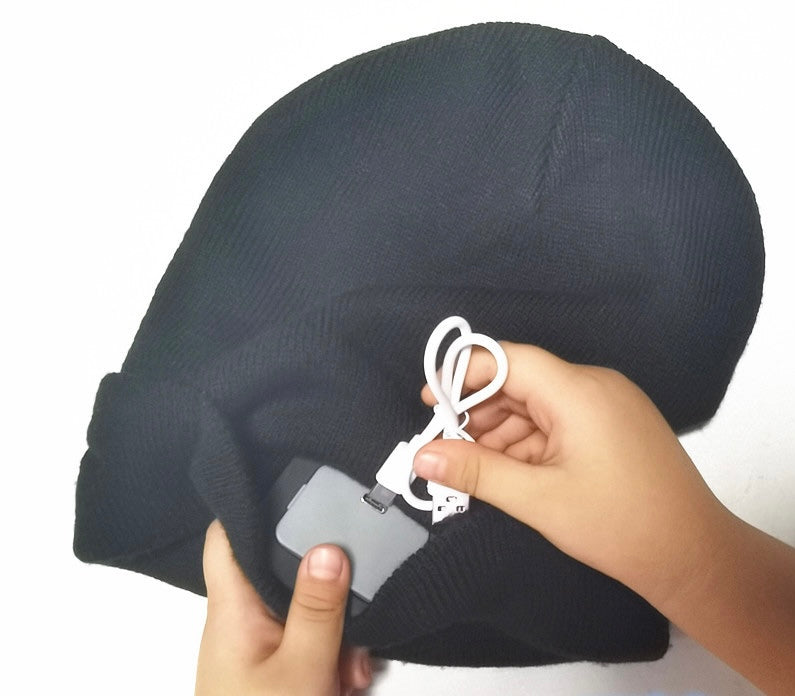 Knit toque with light, USB charging cable, black acrylic material.