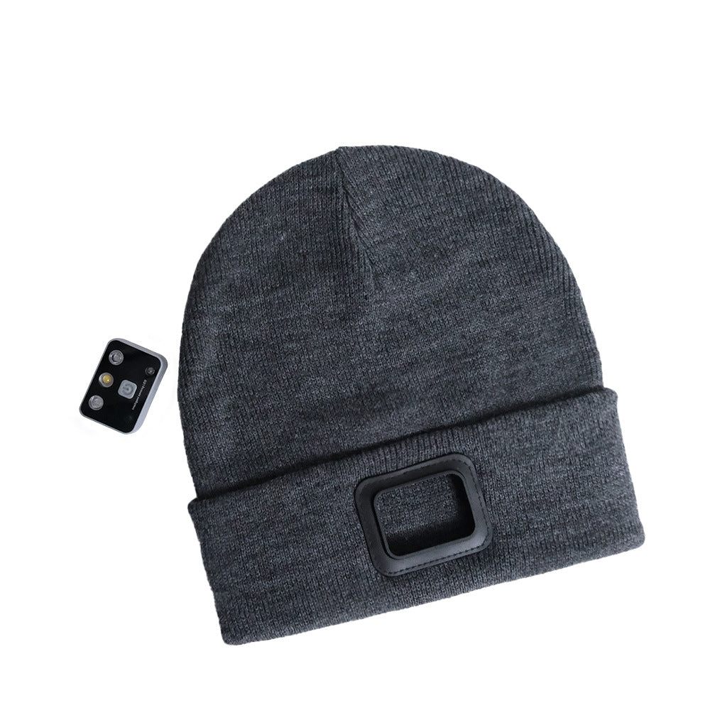 Gray knit toque with built-in light and remote control accessory.