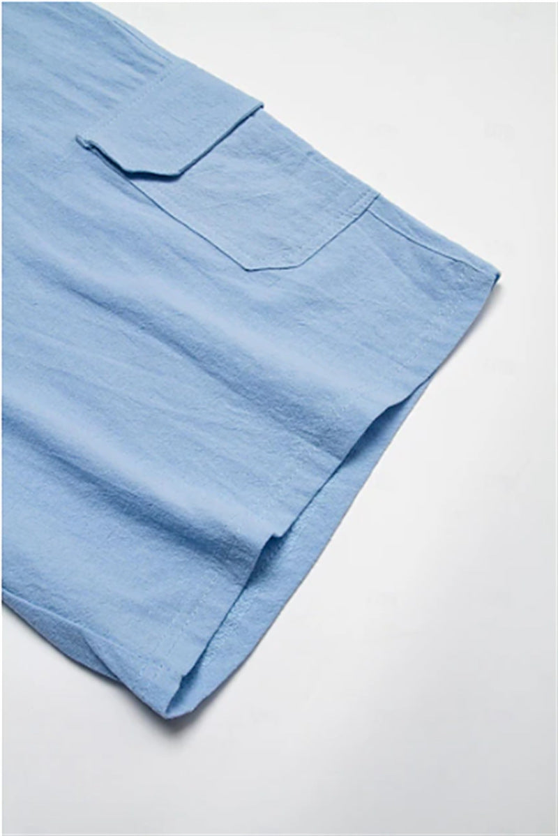 Light blue Bermuda shorts with pocket detail and drawstring waistband.