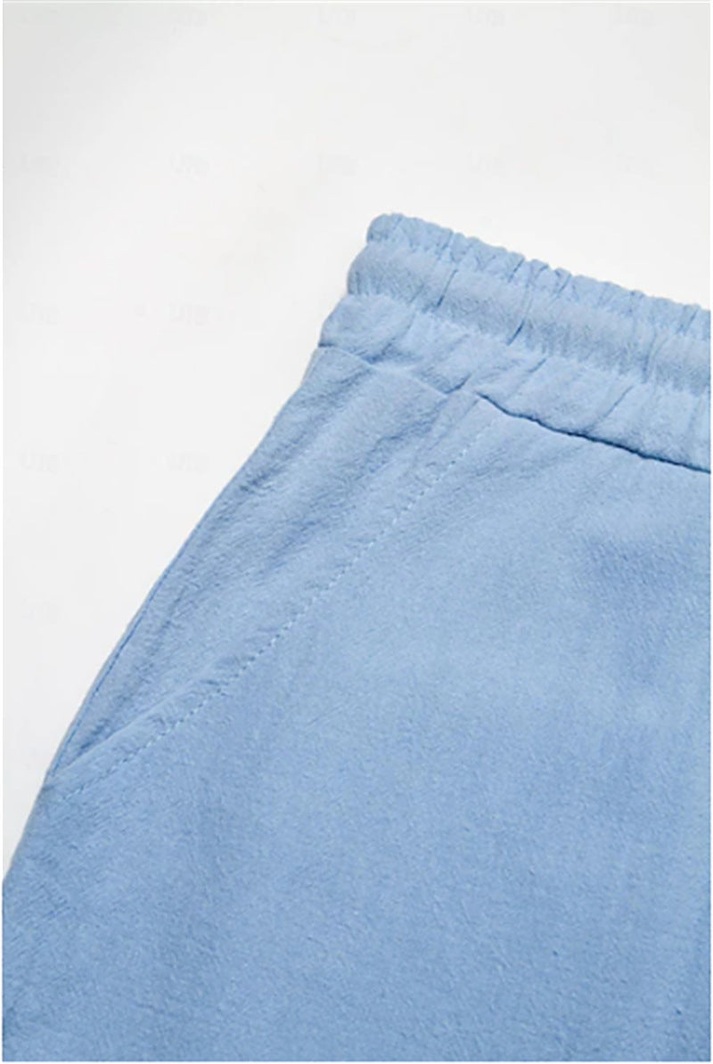 Light blue men's Bermuda shorts with elastic waistband and pockets.