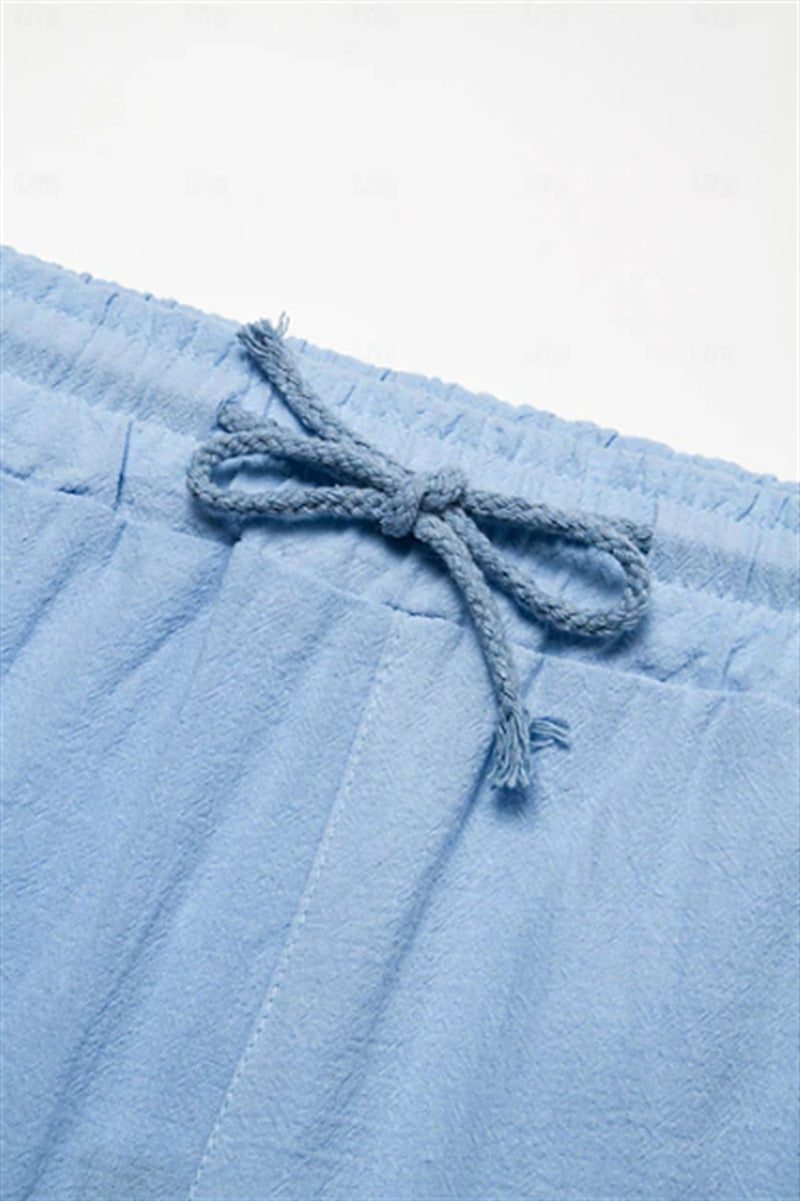 Light blue men's Bermuda shorts with drawstring and pocket details.