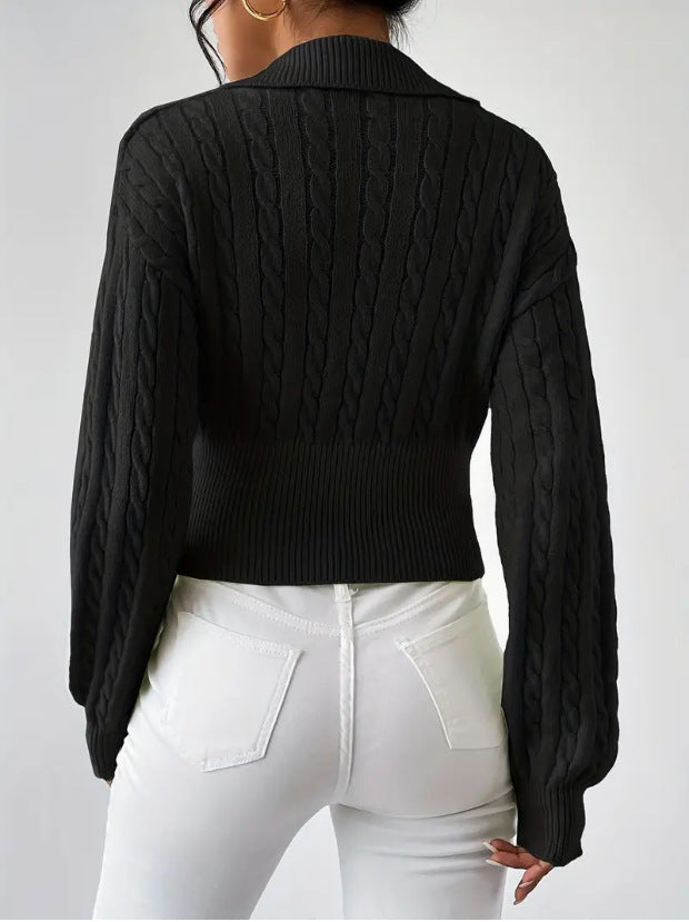 Solid color V-neck cropped sweater with lapel in black.