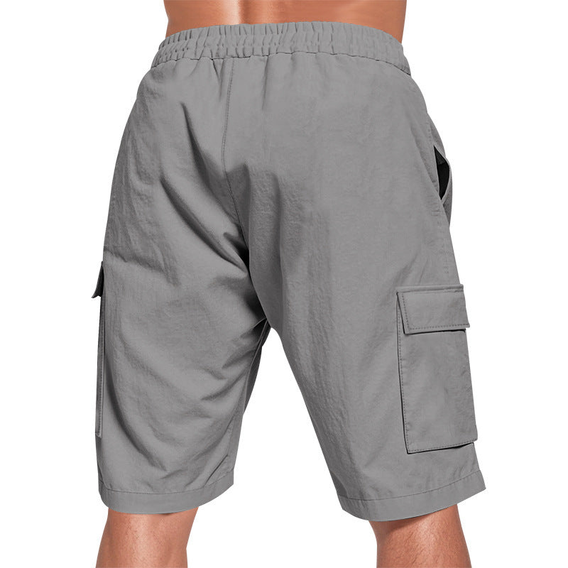 Men's solid color linen shorts with elastic waist and pockets.