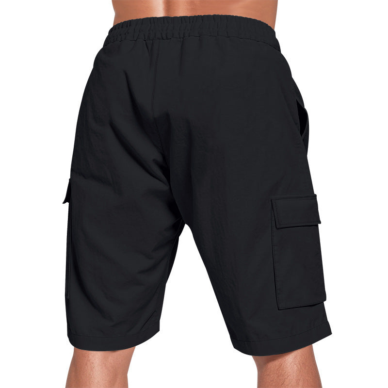 Men's solid color linen shorts with elastic waist and pockets.