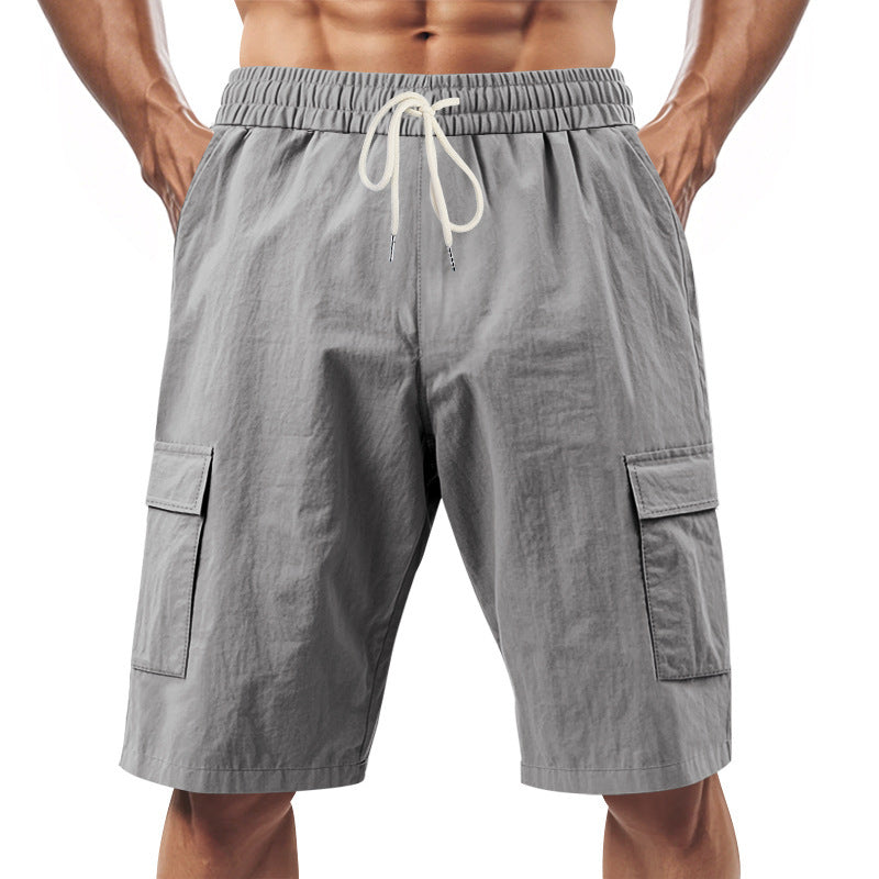 Men's solid color linen shorts with elastic waist and drawstring, featuring side pockets for casual wear.