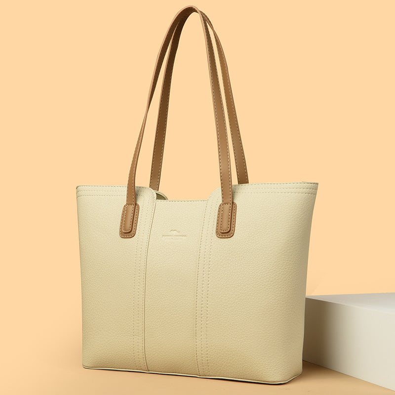 Women's shoulder bag in genuine leather with multiple color options, featuring a stylish high-capacity design.