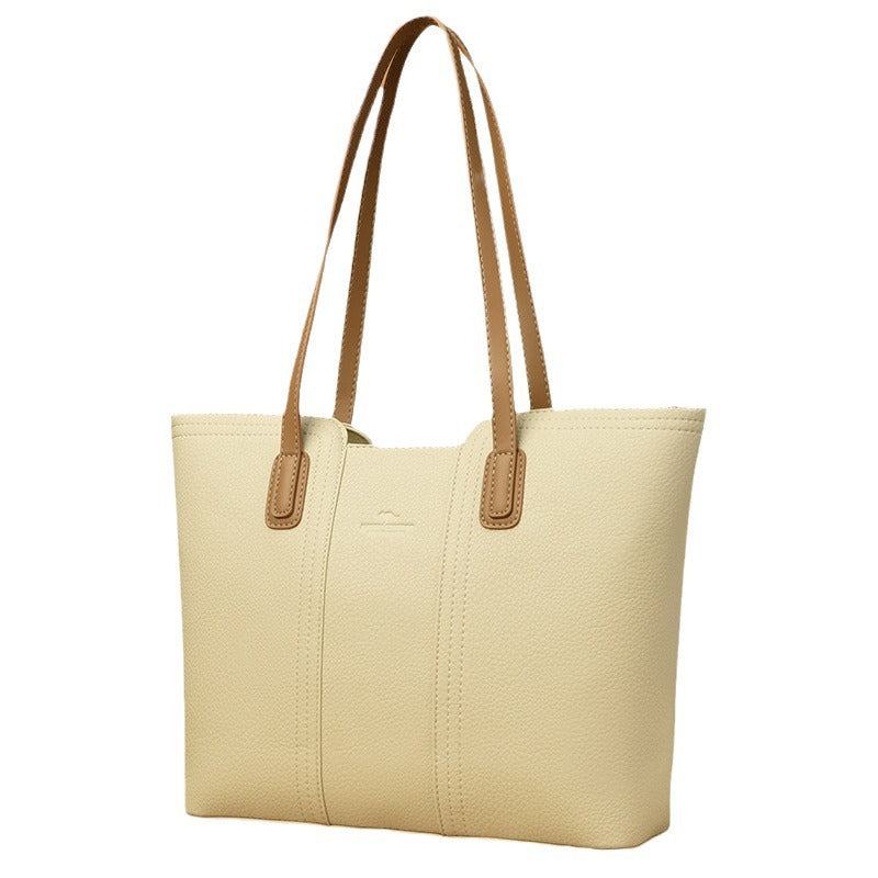 Women's shoulder bag in genuine leather with multiple color options, featuring a stylish high-capacity design.