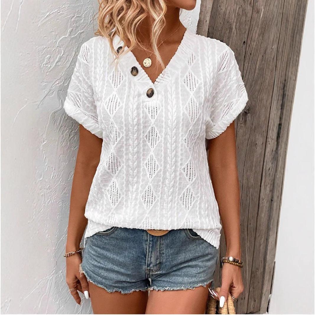 White button V-neck jacquard short sleeve shirt with decorative buttons and stylish pattern.