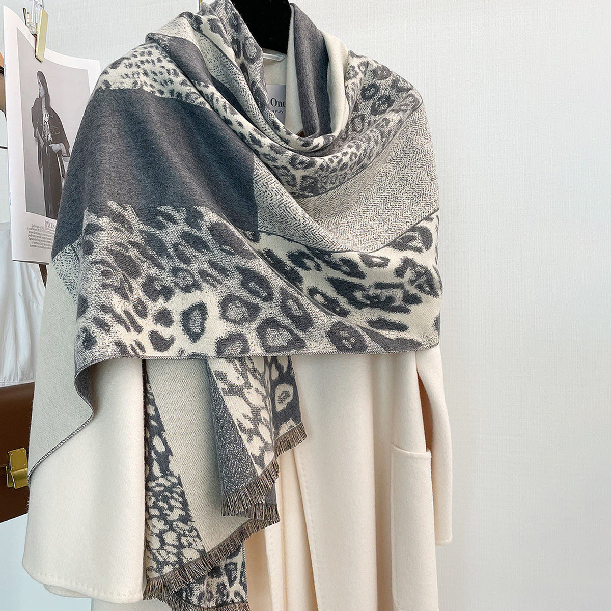 Leopard print shawl in shades of grey, versatile for all seasons.