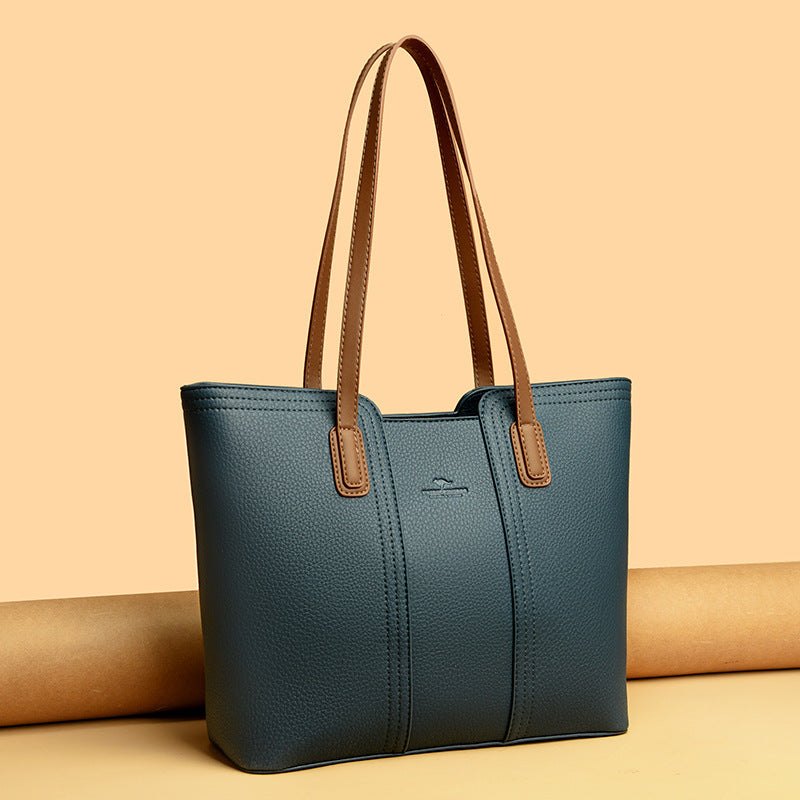 Women's shoulder bag in genuine leather with multiple color options, featuring a stylish high-capacity design.