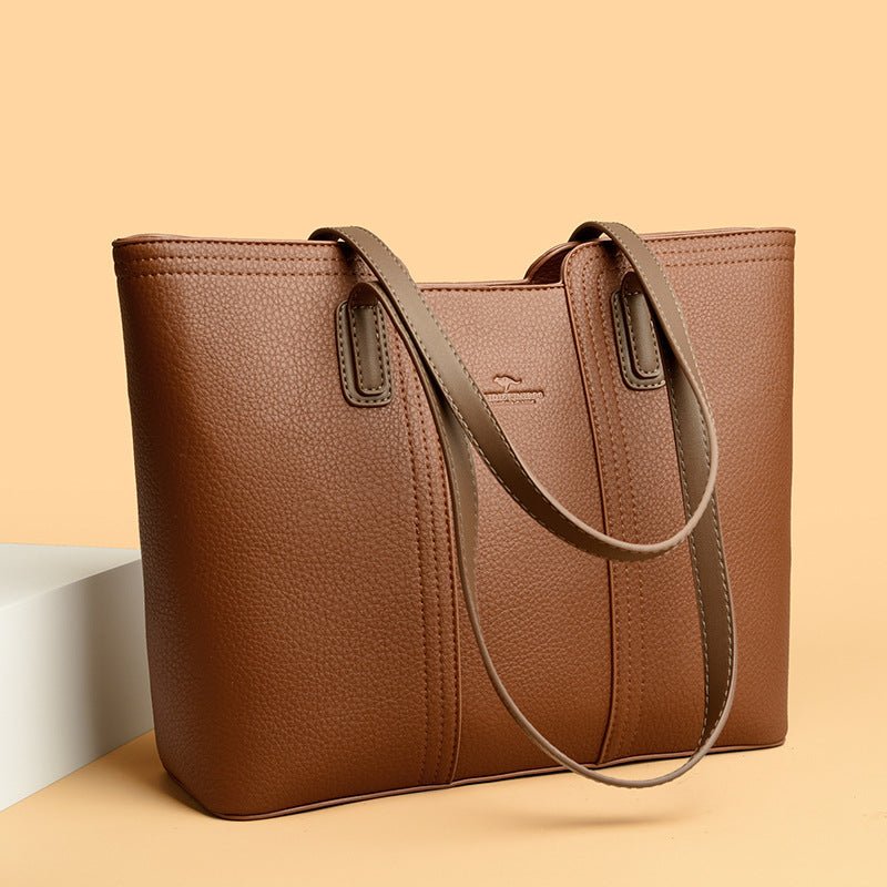 Women's shoulder bag in genuine leather with multiple color options, featuring a stylish high-capacity design.