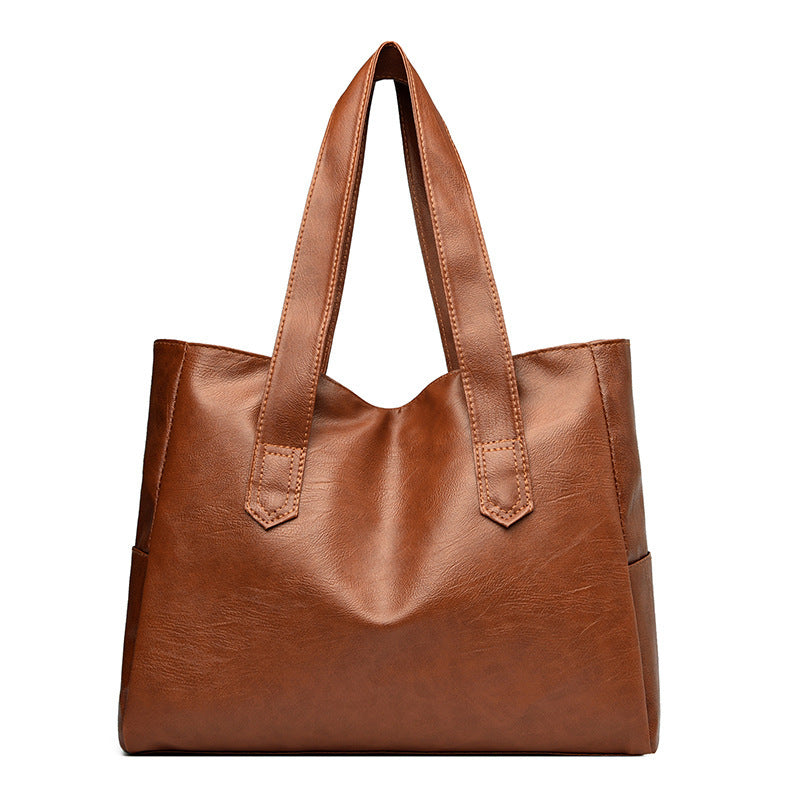 Large capacity brown PU leather tote bag with multiple compartments.