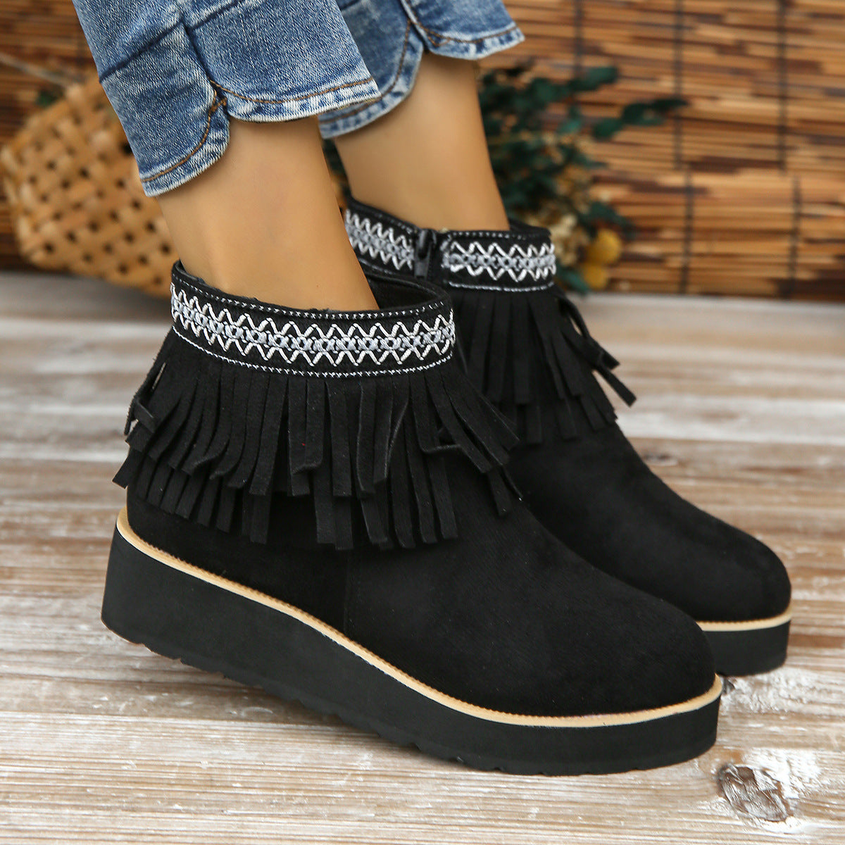 Women's suede ankle boots with fringe and wedge heel in black, fashion thick bottom small wedge bootie.