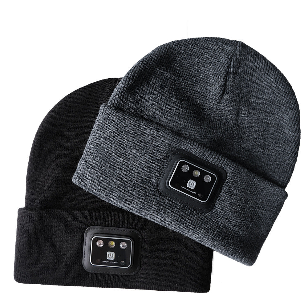 Knit toque with built-in light, black and gray, warm acrylic material.