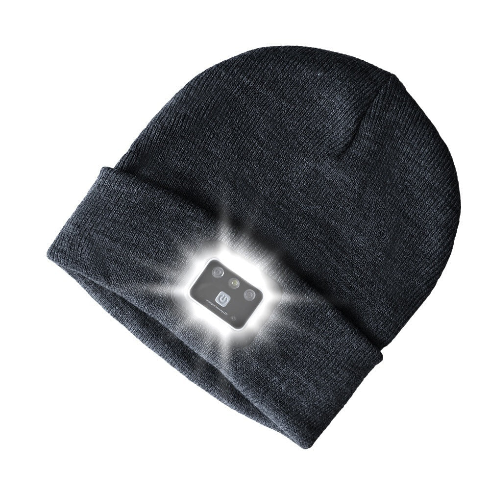 Knitted toque with built-in light in black, ideal for winter outdoor activities.