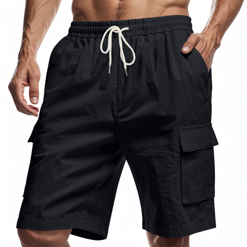 Men’s solid colour linen shorts with drawstring waist and pockets.