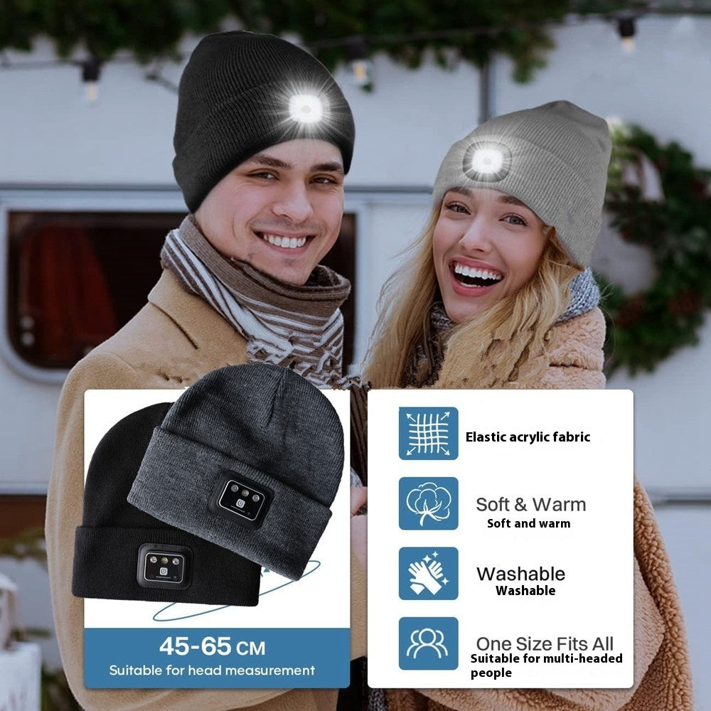 Knit Toque with Light in black and gray worn by a couple outdoors, featuring elastic fit and washable fabric with built-in LED.