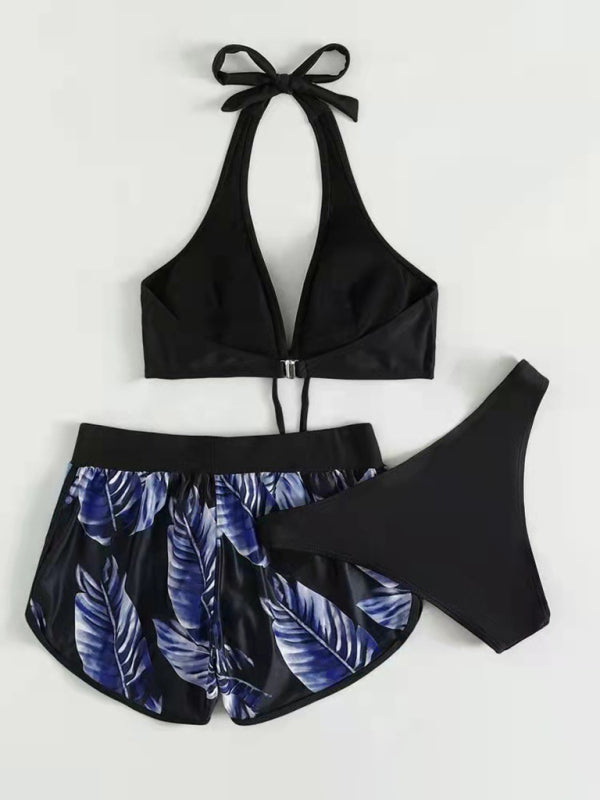 Women’s tropical print halter neck bikini three piece set with bikini top, bottoms, and matching swim shorts.