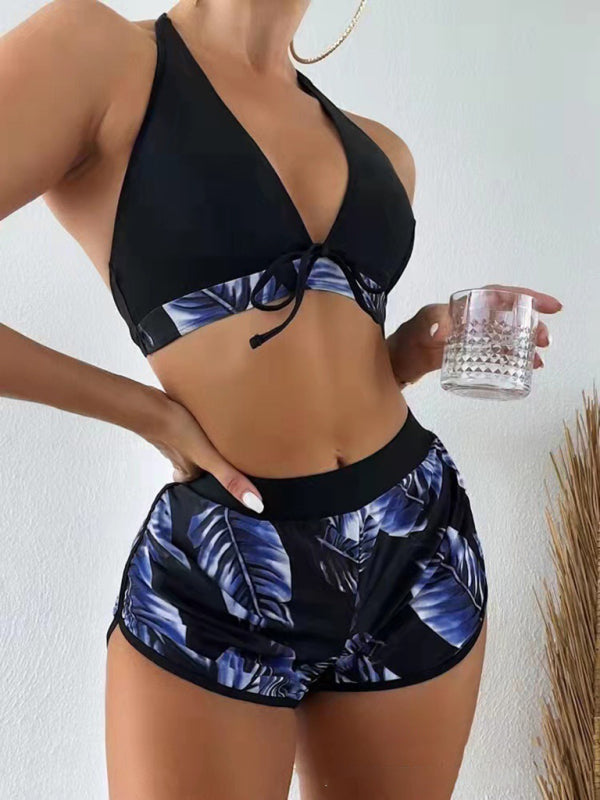 Women’s tropical print halter neck bikini 3-piece set with shorts and top.