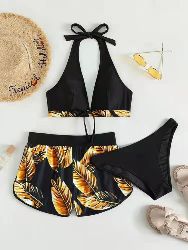 Tropical print halter neck bikini set with matching shorts and bikini bottoms.