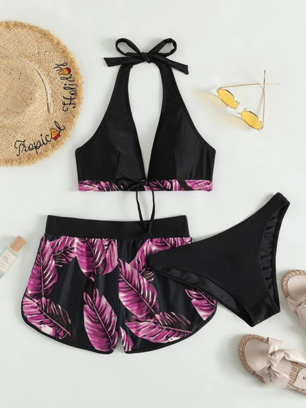 Women’s tropical print halter neck bikini set with shorts and bottoms.