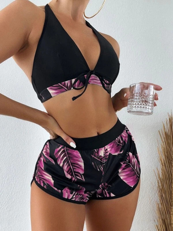 Women's tropical print halter neck bikini set with shorts.