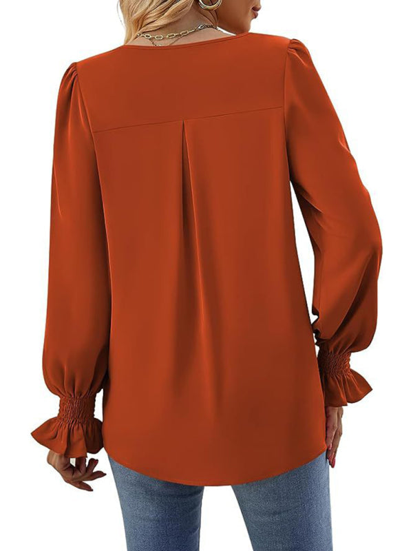 Elegant long sleeve V-neck pleated chiffon blouse in rust color.