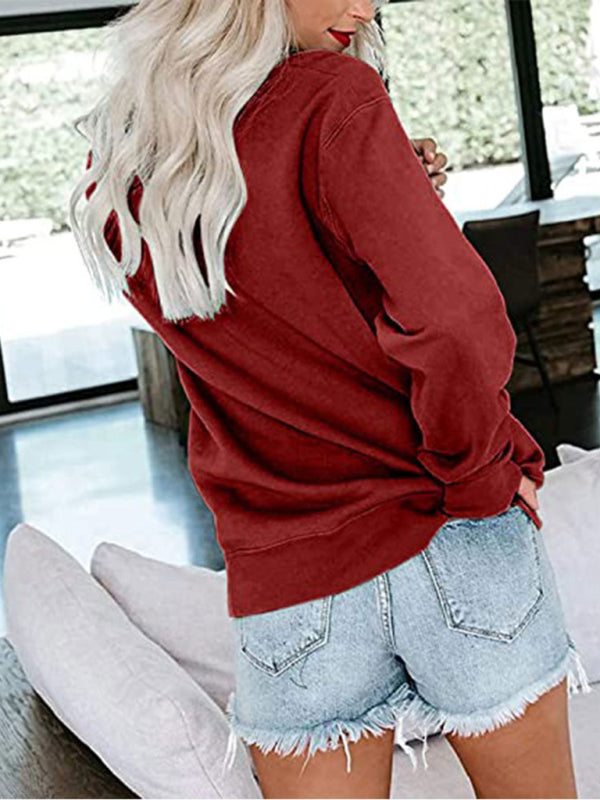 Women’s Christmas crew neck long sleeve sweatshirt in red.