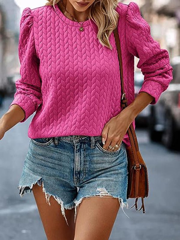 Women's round neck patterned top with puffed long sleeves, pink color, casual style.