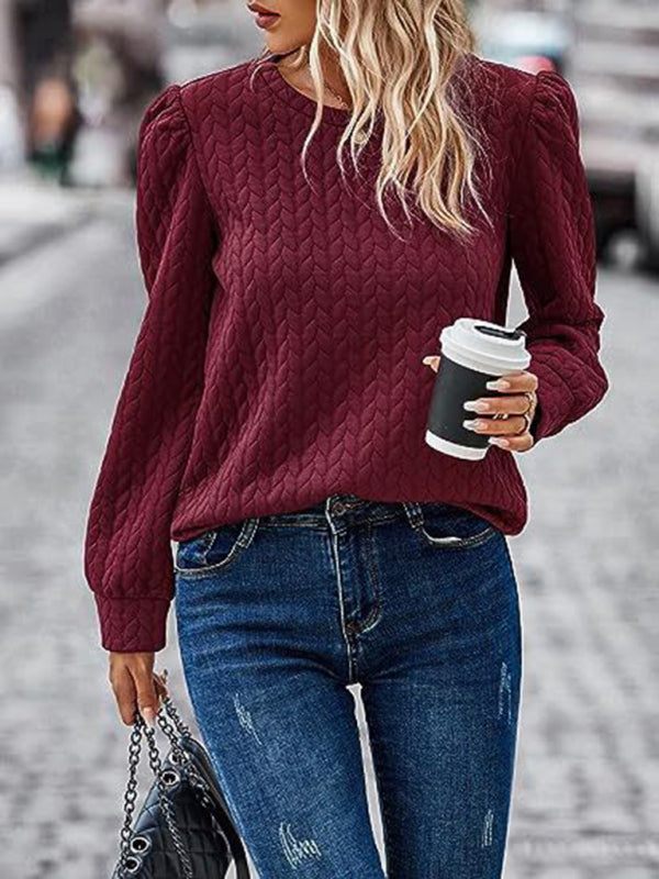 Women's round neck patterned top with puffed long sleeves in burgundy, styled for autumn.