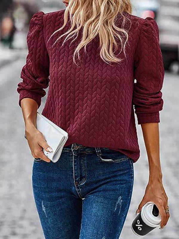 Women’s round neck patterned top with puffed long sleeves in burgundy.